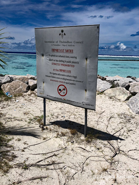 no bikinis on beach sign