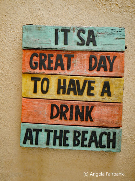 it's a great day to have a drink at the beach sign