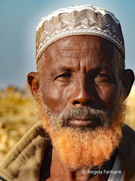 elderly man with hennaed beard