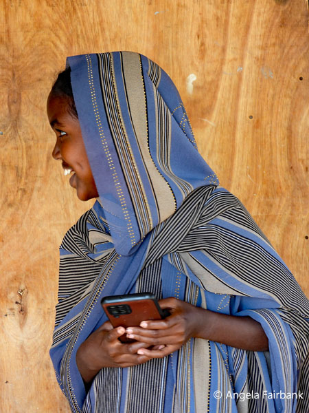 smiling girl facing left