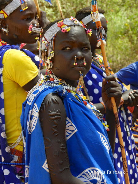 arm scarification detail of Boya girl with nose piercing in blue