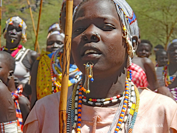 Boya woman dancing with stick
