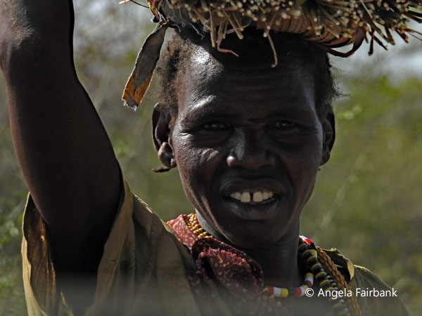 woman carrying house construction material 2