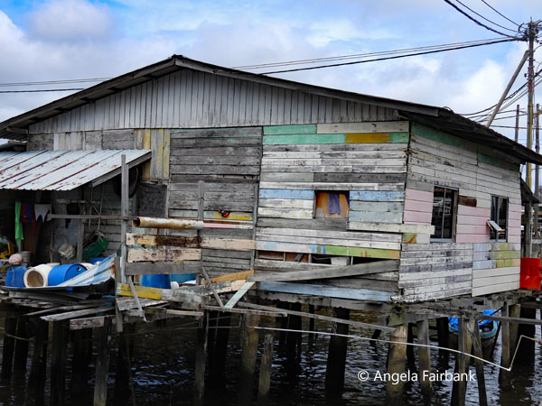 multicoloured house in stilt village
