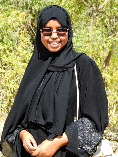 uncovered female university student in black