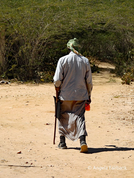 guard with rifle outside cemetery
