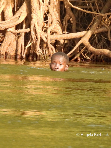 boy swimming in Nile