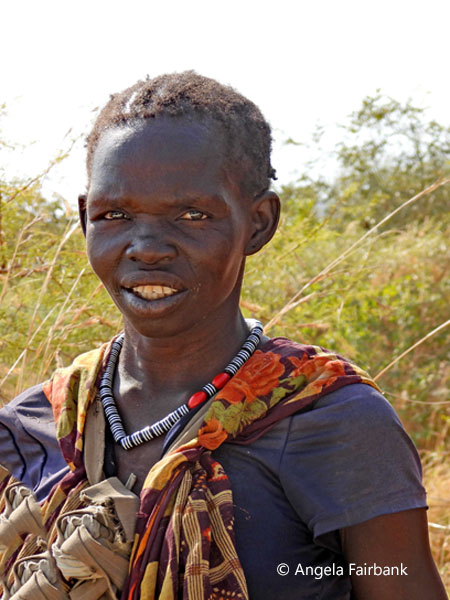 Kuku woman in ble and orange