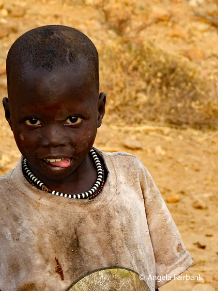 Lotuko boy in stained shirt