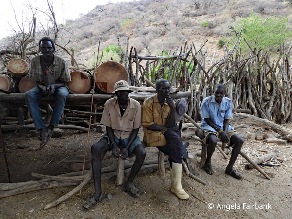 Lotuko men sitting around
