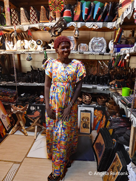 vendor in stall at handicraft market
