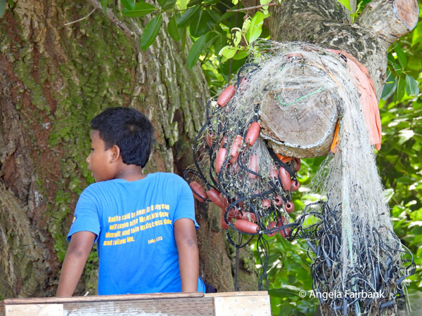 boy and net at Laura beach
