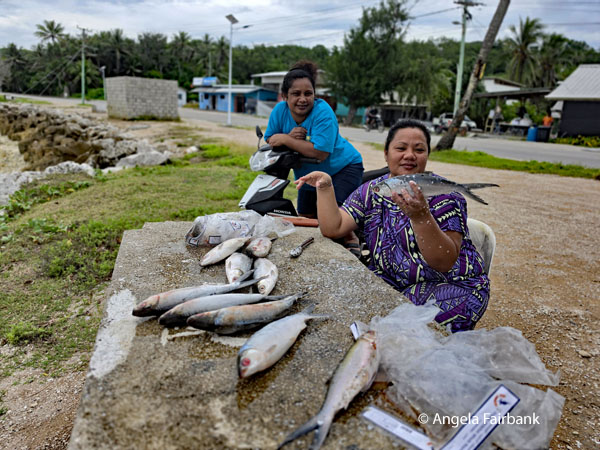 women with fish