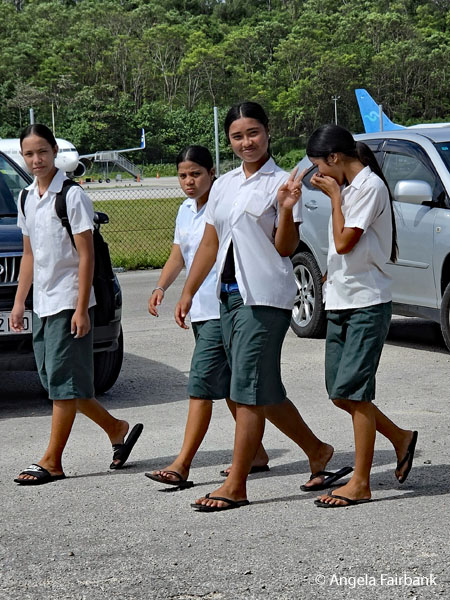 schoolgirls walking past museum