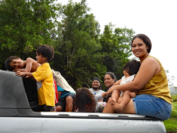 family in back of pick-up truck at Le Mafa Pass