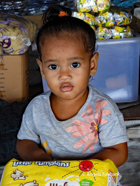 little girl in market