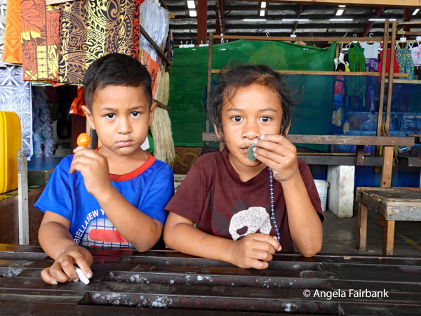two kids at market
