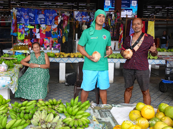 coconut sellers at market