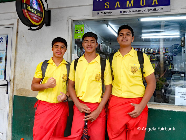 three high school students at market