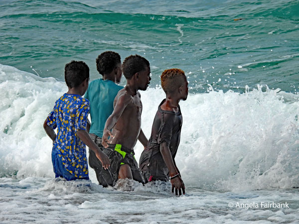 four boys in waves