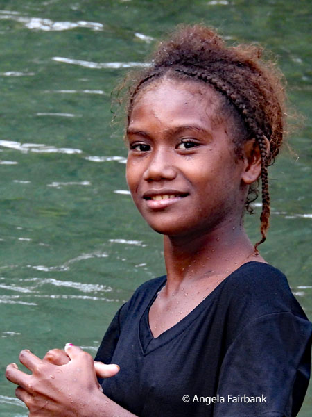 older girl in water with hands folded 2