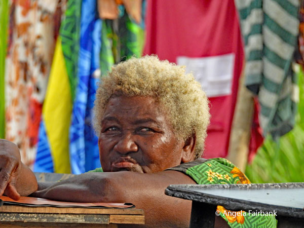 blonde woman at market stall