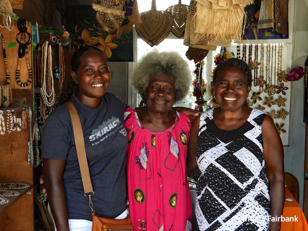vendors at souvenir market two sisters and one daughter