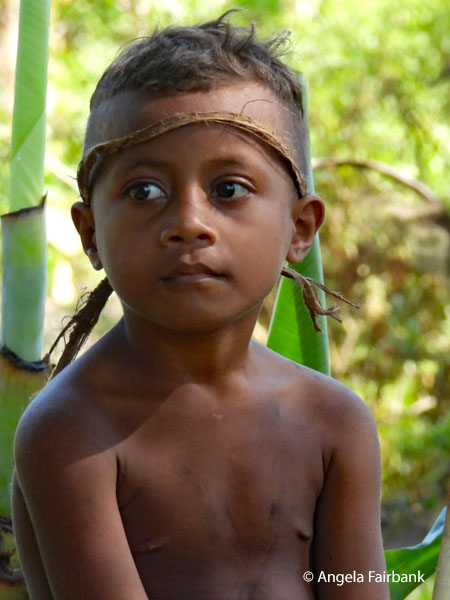boy with brown headband