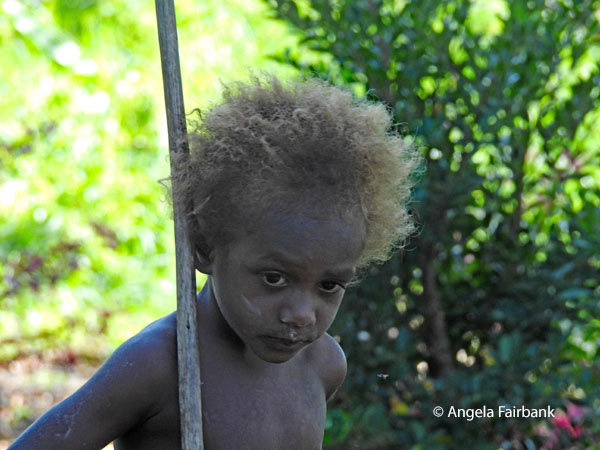 little boy with uprightstick