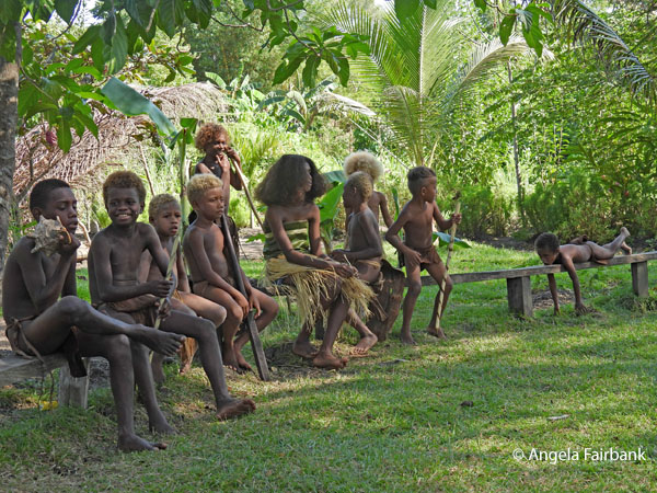 children sitting on bench