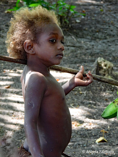 topless boy with stick