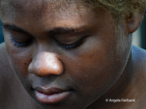 close up of woman face only looking down