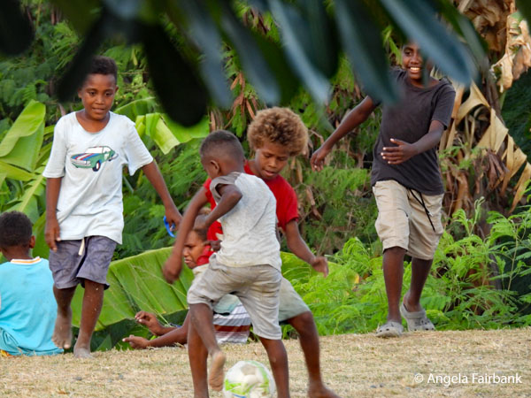 children playing soccer