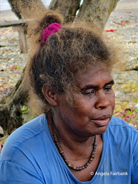 older woman selling watermelon