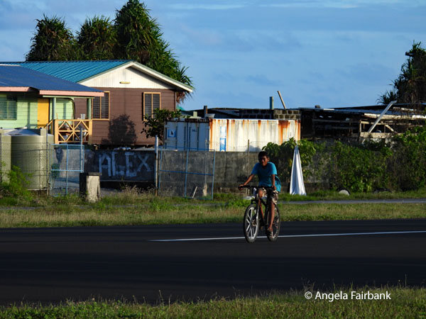 boy on bike on the runway