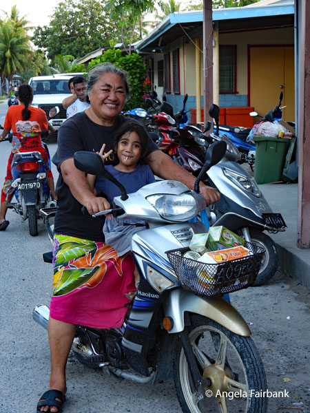 same girl on motorbike with her grandmother