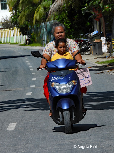 grandma and grandson on motorbike