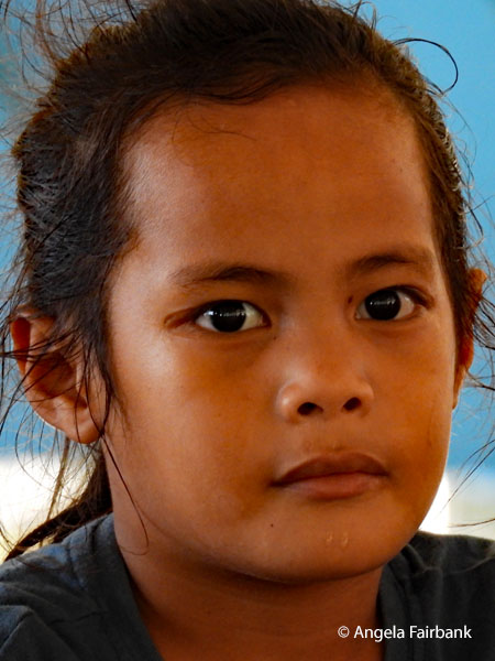 boy with uncut hair at fatele