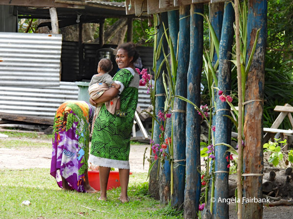 women and baby near museum