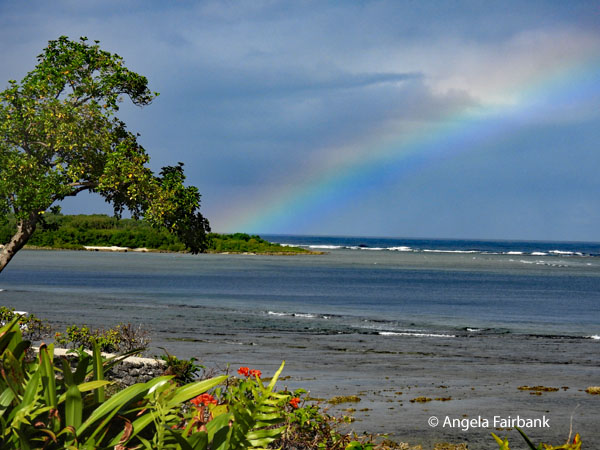 rainbow over beach at our resort