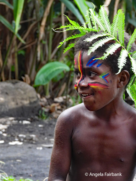 boy with face paint and ferns 1