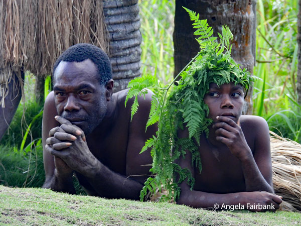 man and boy lying on front