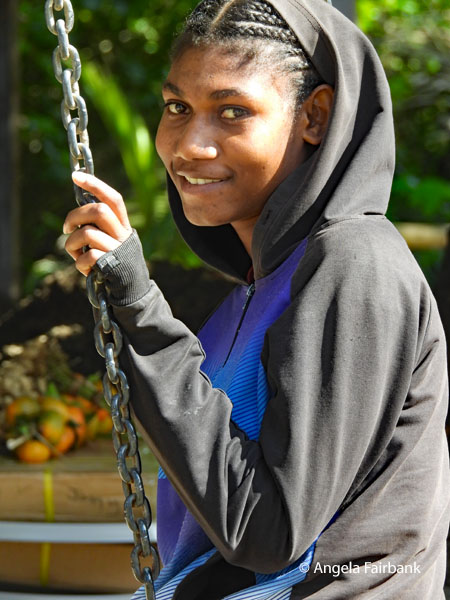 girl on swings in black hoody