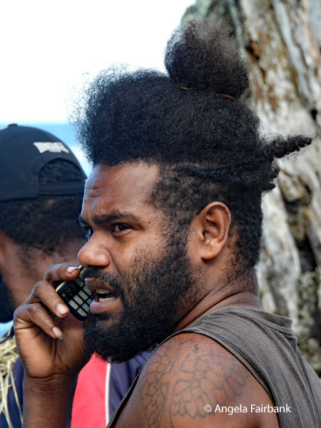 bearded man on cell phone