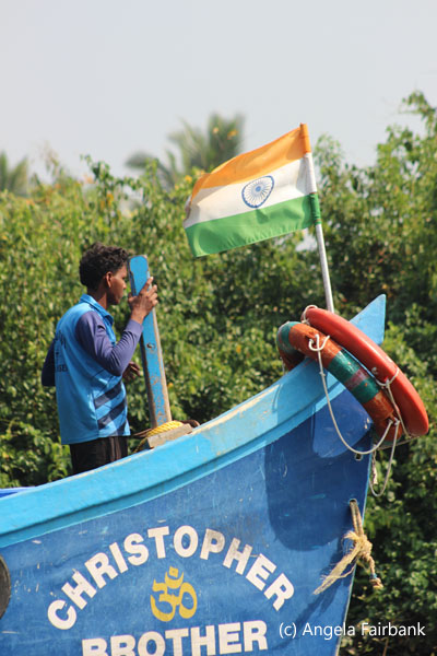 man in bow of boat
