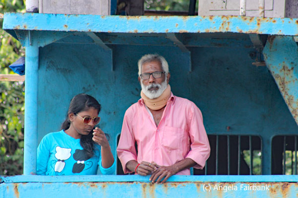 man and girl in ferry