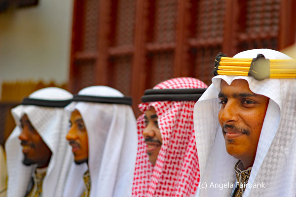 four men in costume at the museum