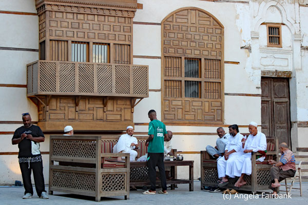 group of men sitting in al balad