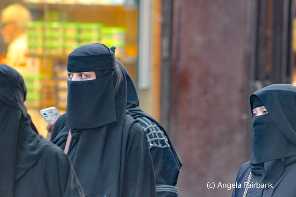 three women in black