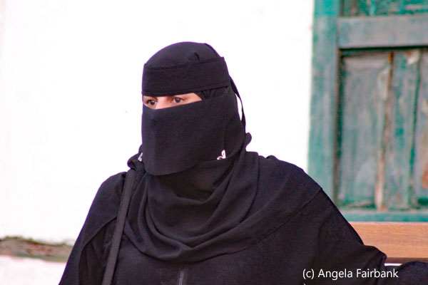 woman in black standing